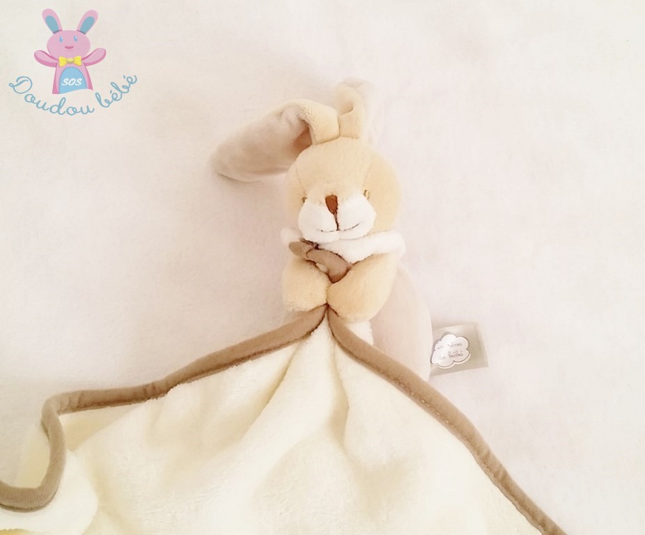 Doudou Lapin beige marron blanc couverture Un rêve de bébé