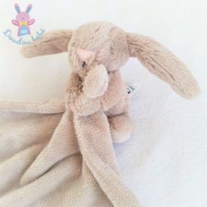 Doudou lapin beige crème tenant un mouchoir